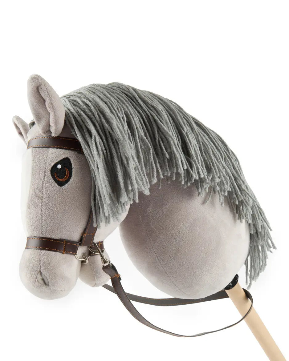 Seitenansicht Graues Bieco Hobby Horse mit weißer Blesse und brauner Trense